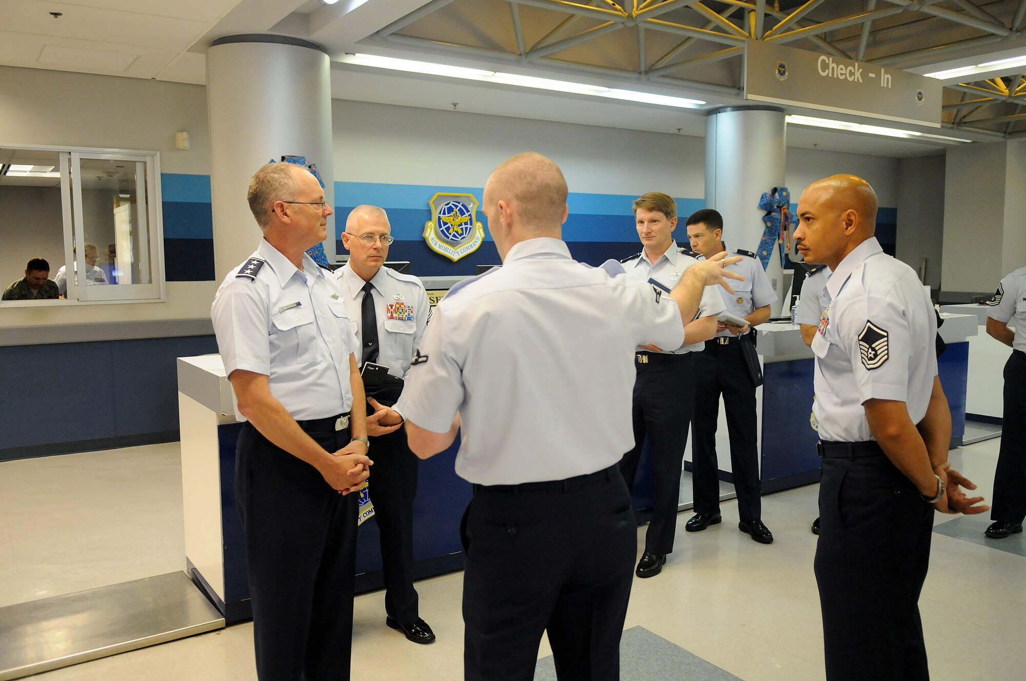 Airman Alex Crawford of the 733d Air Mobility Squadron, gives a tour Lt. Gen. Robert Allardice, 18th Air Force commander, and his staff Sept. 27. Lt. Gen. Allardice took a tour of the 733d Air Mobility Squadron facilities and met the Airmen there. (U.S. Air Force photo/Staff Sgt. Jonathan Steffen)