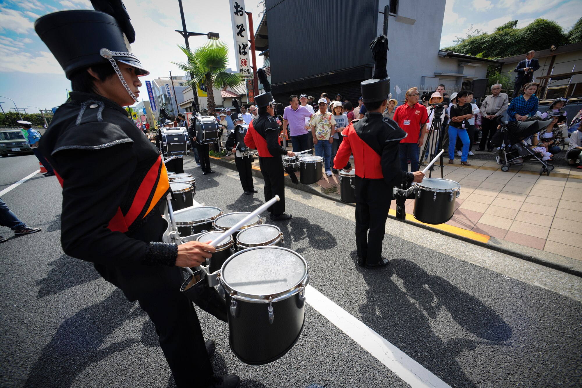 YOKOTA AIR BASE, Japan - Soka University Brass and Drums Corps performed during the 2010 Fussa International Festival Parade, 26 Sept. This band was one of four bands to perform for the crowds that gathered right outside Yokota's gates. (U.S. Air Force photo by Staff Sgt Stacy Moless)