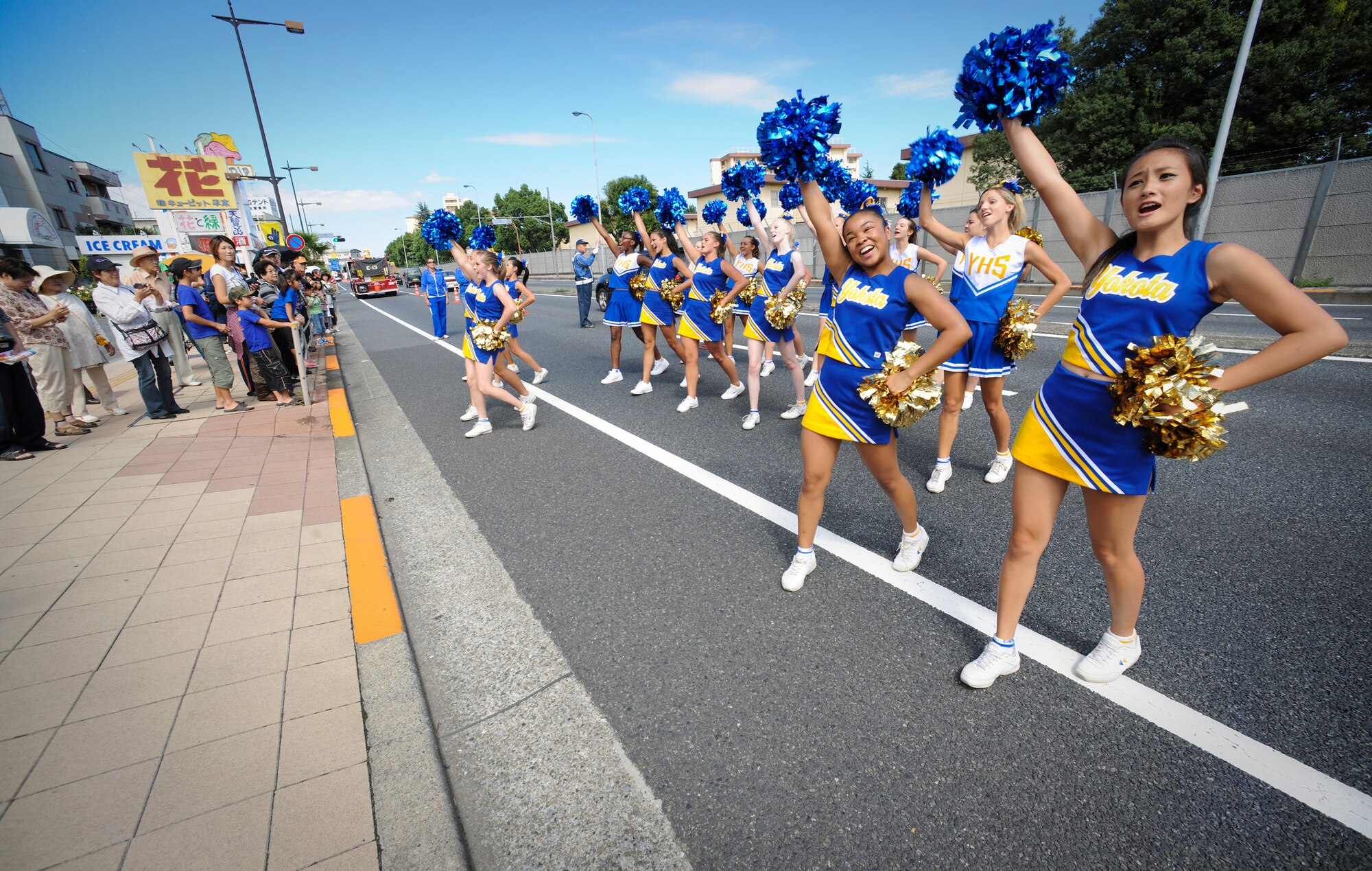 YOKOTA AIR BASE, Japan - Cheerleaders from Yokota High School perform cheers and dance routines to entertain the crowd during the 2010 Fussa International Festival Parade, 26 Sept. The parade is a great opportunity for the Yokota community to show the surrounding communities a little bit about Yokota Air Base. (U.S. Air Force photo by Staff Sgt Stacy Moless)