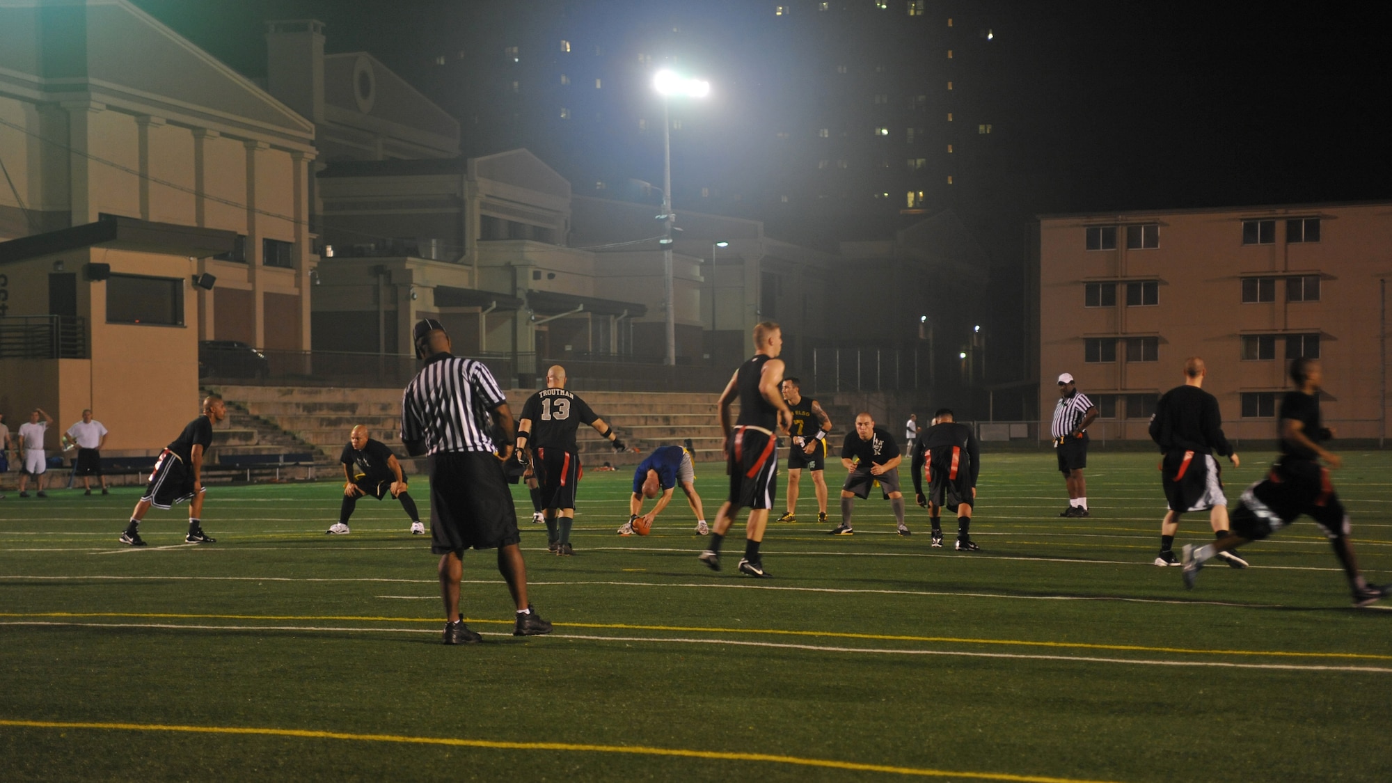 51st Communications Squadron and 51st Maintenance Operations Squadron Airmen compete during an intramural flag football game at Osan Air Base, Republic of Korea, Sept. 20. (U.S. Air Force photo/Senior Airman Evelyn Chavez)