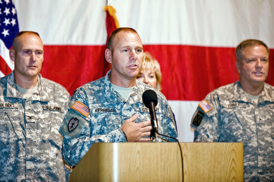 U.S. Army Command Sgt. Maj. Daniel Kerrigan leads the pledge of allegiance during the departure ceremony for the Indiana National Guard's 3-19th Agribusiness Development Team on Camp Atterbury Joint Maneuver Training Center, Ind., Sept. 25, 2010. The team is a special group of more than 60 guardsmen from across Indiana who have agricultural experience or education in several fields, including forestry, engineering, general farming, pest management, horticulture, marketing and education. These soldiers will deploy to Afghanistan to assist Afghan leaders in improving agricultural practices.