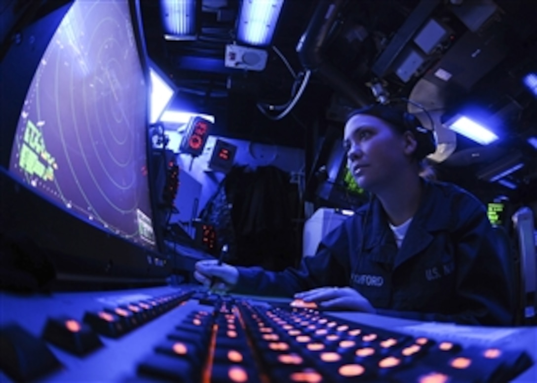 U.S. Navy Airman Chelsea Pitchford monitors an air approach radar console in the air traffic control center aboard the amphibious assault ship USS Essex (LHD 2) while underway in the Philippine Sea on Sept. 21, 2010.  The Essex Amphibious Ready Group is participating in Valiant Shield 2010, a joint U.S. military exercise in the western Pacific.  