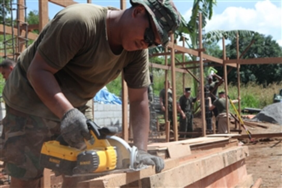 Airmen from the 355th Aviation Engineering Wing, Philippine Air Force and U.S. Marines with Engineering Operations, Marine Wing Support Squadron 172, 1st Marine Air Wing build classrooms at the Maganday Nobokah Aeta School in Papanga, Republic of the Philippines, during Amphibious Landing Exercise 2009 on Sept. 23, 2010.  The exercise contains a bilateral training element and security assistance program between the U.S. military and the Armed Forces of the Philippines.  
