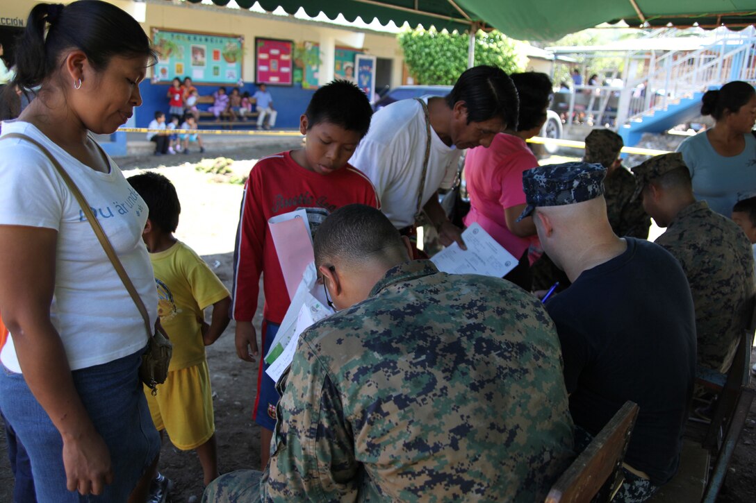 Continuing Promise Marines and sailors help Panamanian citizens fill out the necessary paperwork to be medically screened at Rambala Maternity Clinic in Punta Pina, Panama, Sept. 28, 2010. The clinic is being used as a medical site for Continuing Promise personnel to conduct medical operations. Marines and Sailors of CP10 are anchored off the coast of Chiriqui Grand, Panama, to conduct humanitarian operations for 10 days. CP10 is a humanitarian civic assistance mission that provides medical, dental, veterinary, engineering support and disaster relief efforts to the Caribbean, Central and South America.