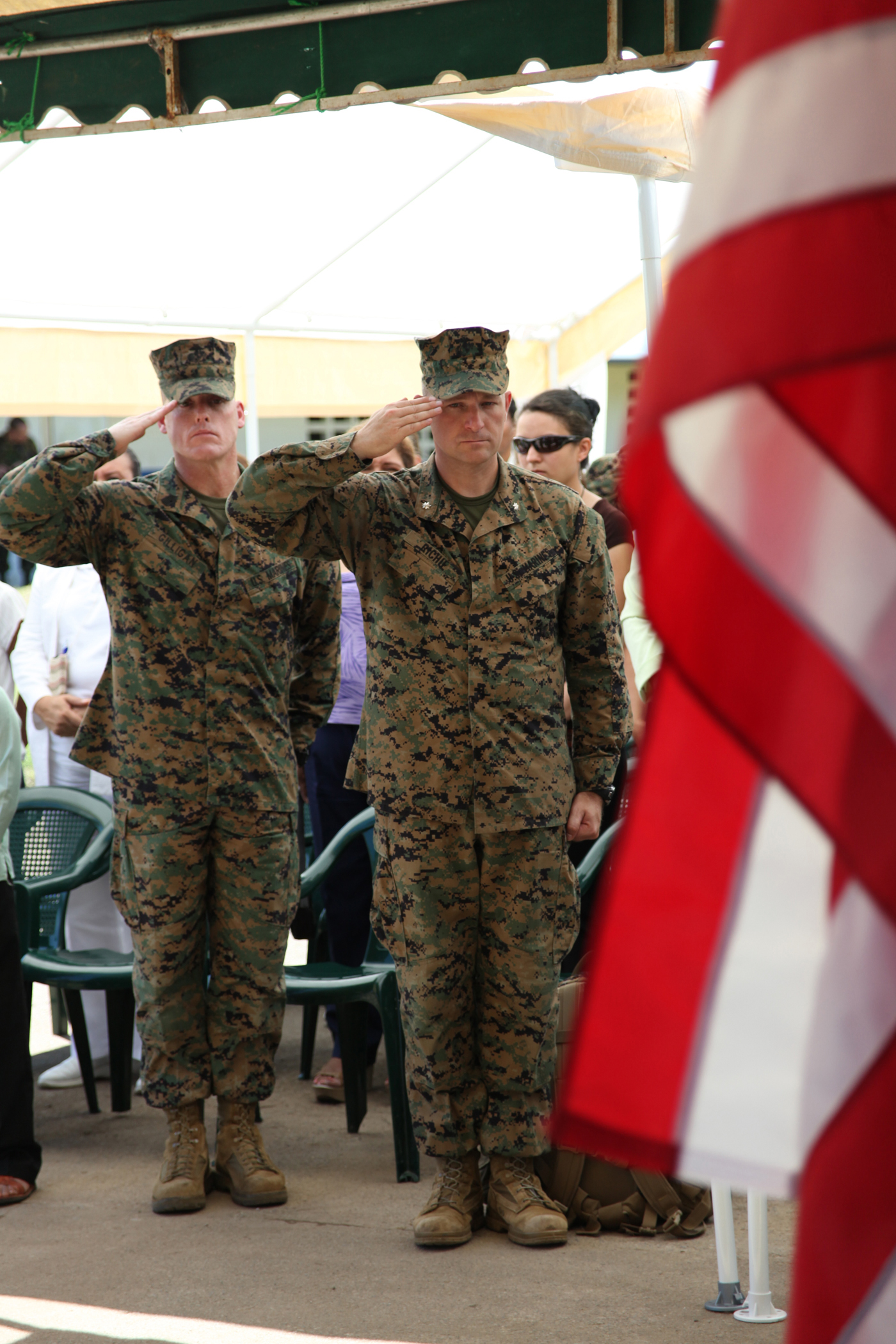 (From left) Sgt. Maj. Kevin J. Gilligan, sergeant major of Marine Medium Helicopter Squadron 774, and Lt. Col. Chris S. Richie, commanding officer of Special-Purpose Marine Air-Ground Task Force Continuing Promise 2010, salute the U.S. flag during the national anthem at the Panama opening ceremony held at Rambala Maternity Clinic in Punta Pina, Panama, Sept. 28, 2010. Marines and Sailors of CP10 are anchored off the coast of Chiriqui Grand, Panama, to conduct humanitarian operations for 10 days. CP10 is a humanitarian civic assistance mission that provides medical, dental, veterinary, engineering support and disaster relief efforts to the Caribbean, Central and South America.