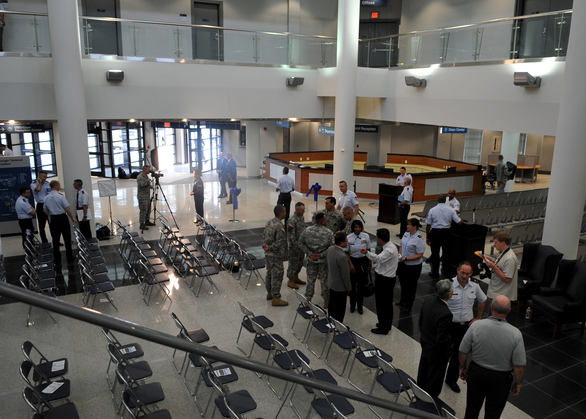Guests gather around the new Osan passenger terminal Sept. 27 following a ribbon-cutting ceremony Sept. 27. The event was attended by 515th Air Mobility Operations Wing, 7th Air Force, 51st Fighter Wing, local Korean leadership, and others. (U.S. Air Force photo/Senior Airman Evelyn Chavez)