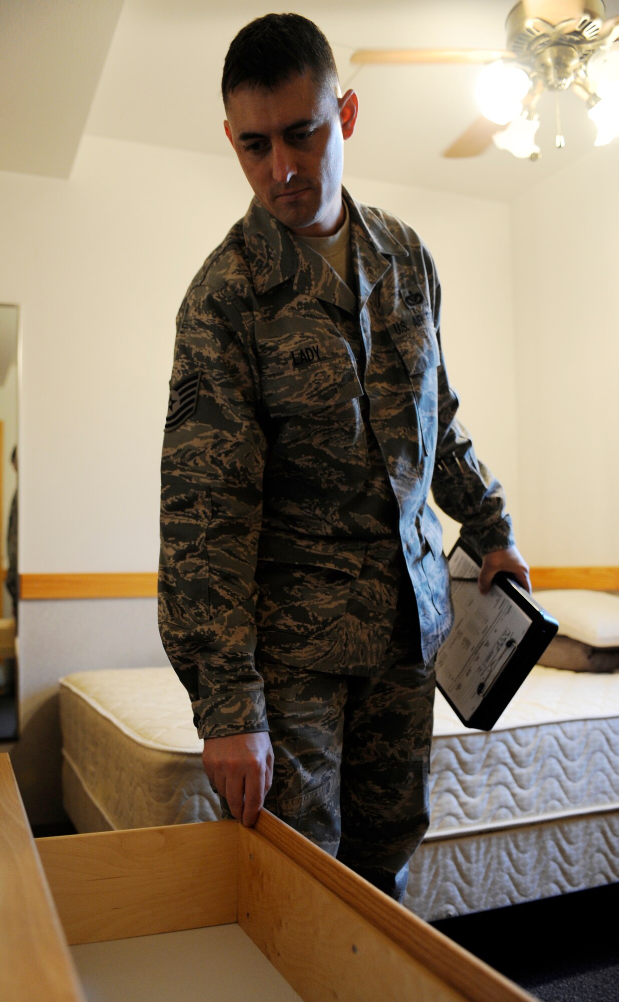 Tech. Sgt. Jason Lady inspects a room Sept. 24, 2010, Eielson Air Force Base, Alaska. Sergeant Lady follows the checklist to ensure living standards and resources are properly maintained. Sergeant Lady is an Airman Dormitory Leader assigned to the 354th Civil Engineer Squadron. (U.S. Air Force photo/Senior Airman Willard E. Grande II)