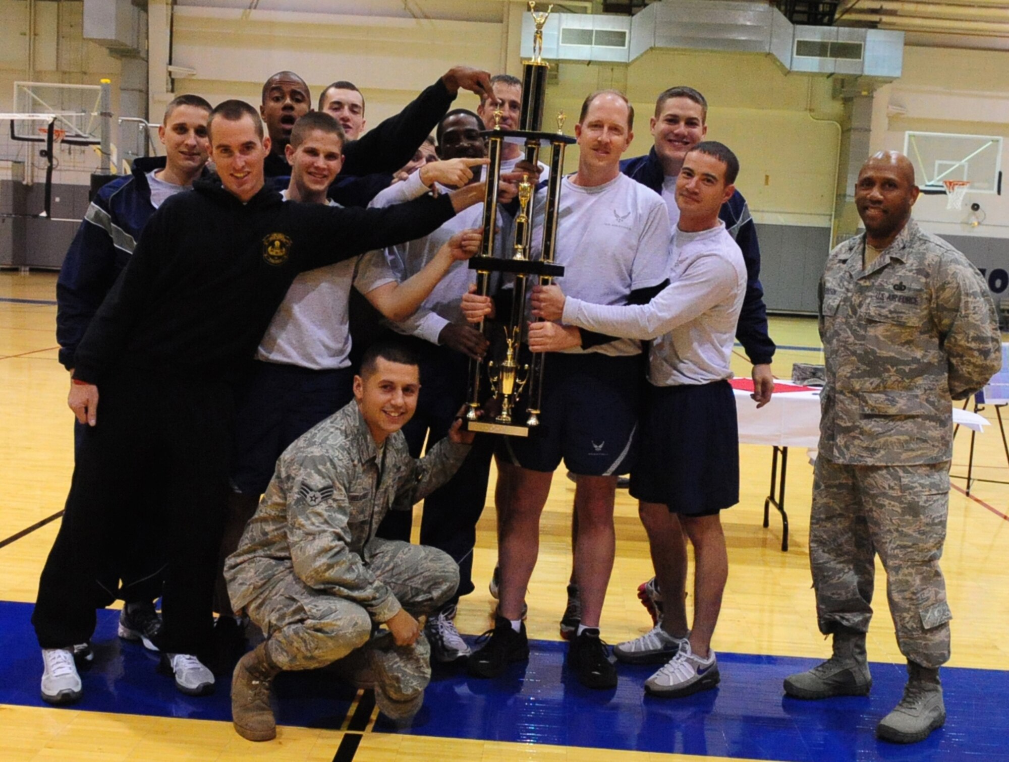 The 354th Civil Engineering Squadron took home first place trophy after participating at the base Sports Day held at the Baker Field House Fitness Center as Sept. 24 , 2010, Eielson Air Force Base, Alaska. There was a variety of indoor and outdoor sports hosted as well as a free lunch funded by the 354th Force Support Squadron. (U.S. Air Force photo/Airman 1st Class Laura Goodgame)