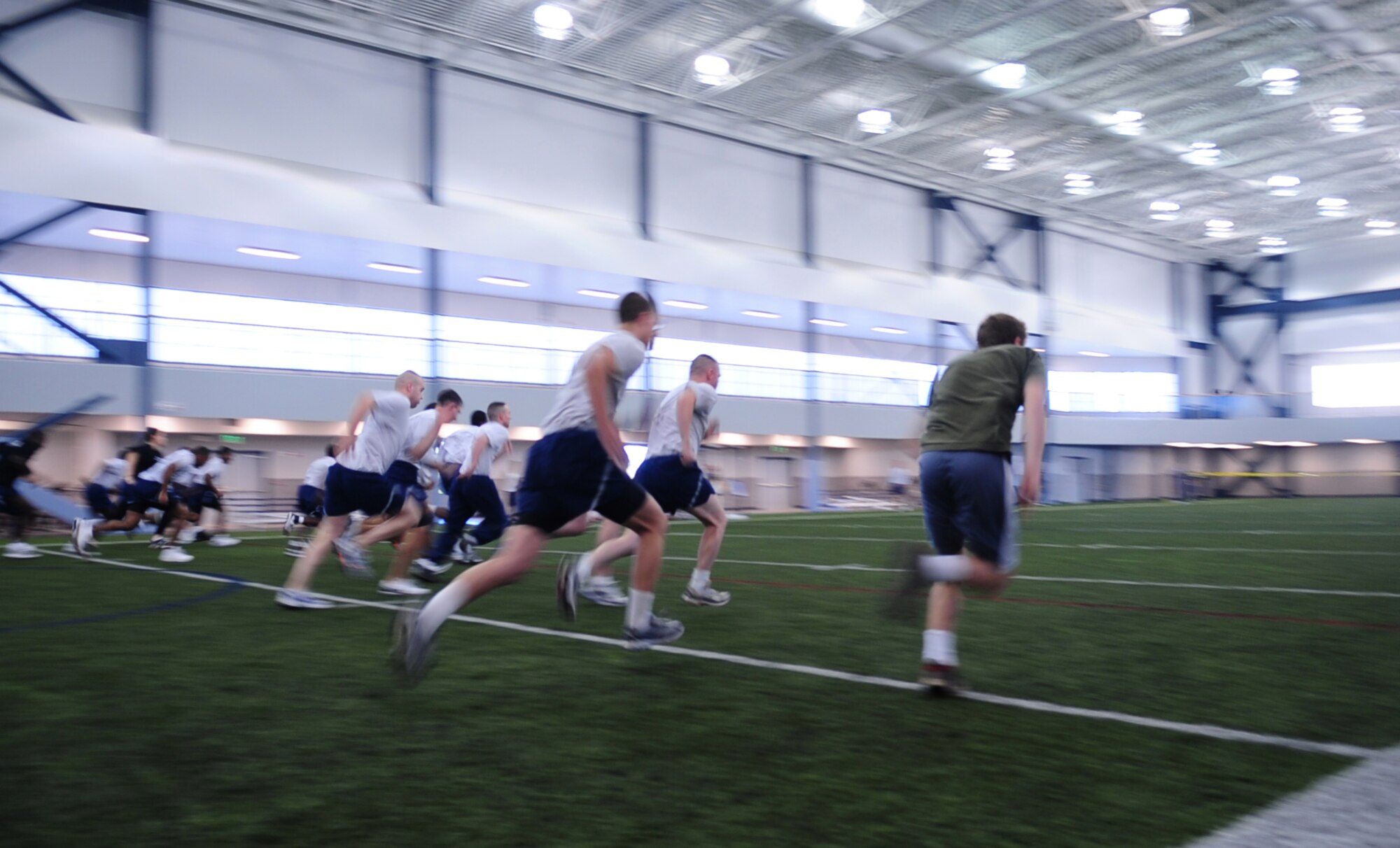 Airmen sprint in the 50 yard dash during Sports Day at Baker Field House Fitness Center Sept. 24, 2010, Eielson Air Force Base, Alaska. There were a variety of indoor and outdoor sports hosted as well as a free lunch funded by the Force Support Squadron. (U.S. Air Force photo/Airman 1st Class Laura Goodgame)