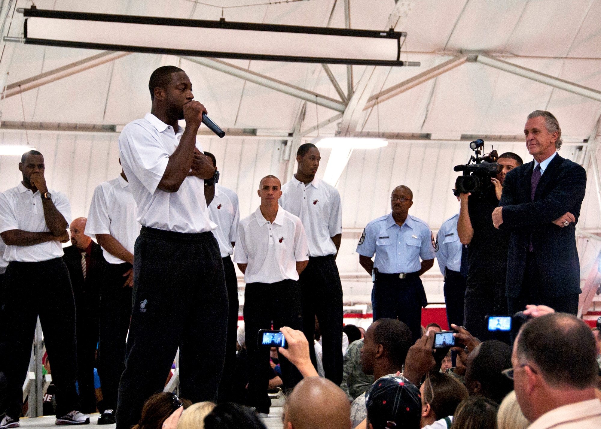 Dwyane Wade, Miami HEAT guard, thanks military members during a welcome reception at an Eglin Air Force Base hangar Sept. 27. The team chose Hurlburt Field's gym as the location for their week-long training camp. In between practice times they will interact with the military communities at both bases. (U.S. Air Force Photo/Samuel King, Jr.)