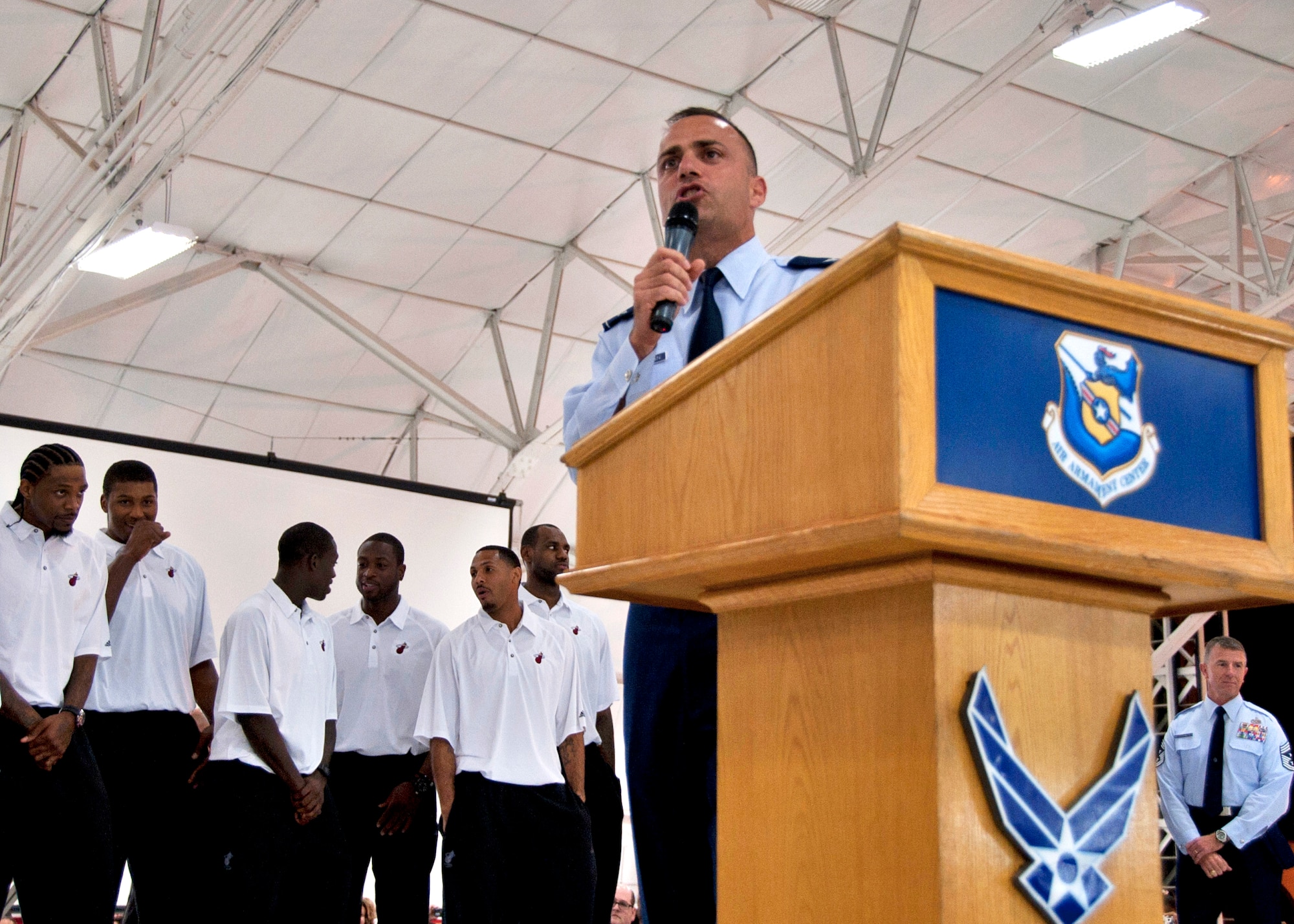 Col. Sal Nodjomian, 96th Air Base Wing commander, welcomes the Miami HEAT to his installation during a reception at an Eglin Air Force Base hangar Sept. 27. The team chose Hurlburt Field's gym as the location for their week-long training camp. In between practice times they will interact with military communities at both bases. (U.S. Air Force Photo/Samuel King, Jr.)