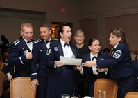 Airmen play name that tune during the 37th Training Wing's Air Force Birthday Ball Sept. 19 at the Gateway Club. The celebration included dancing, socializing, dinner and entertainment from the Band of the U.S. Air Force Reserve, Robins Air Force Base, Ga. (U.S. Air Force photo/Alan Boedeker)