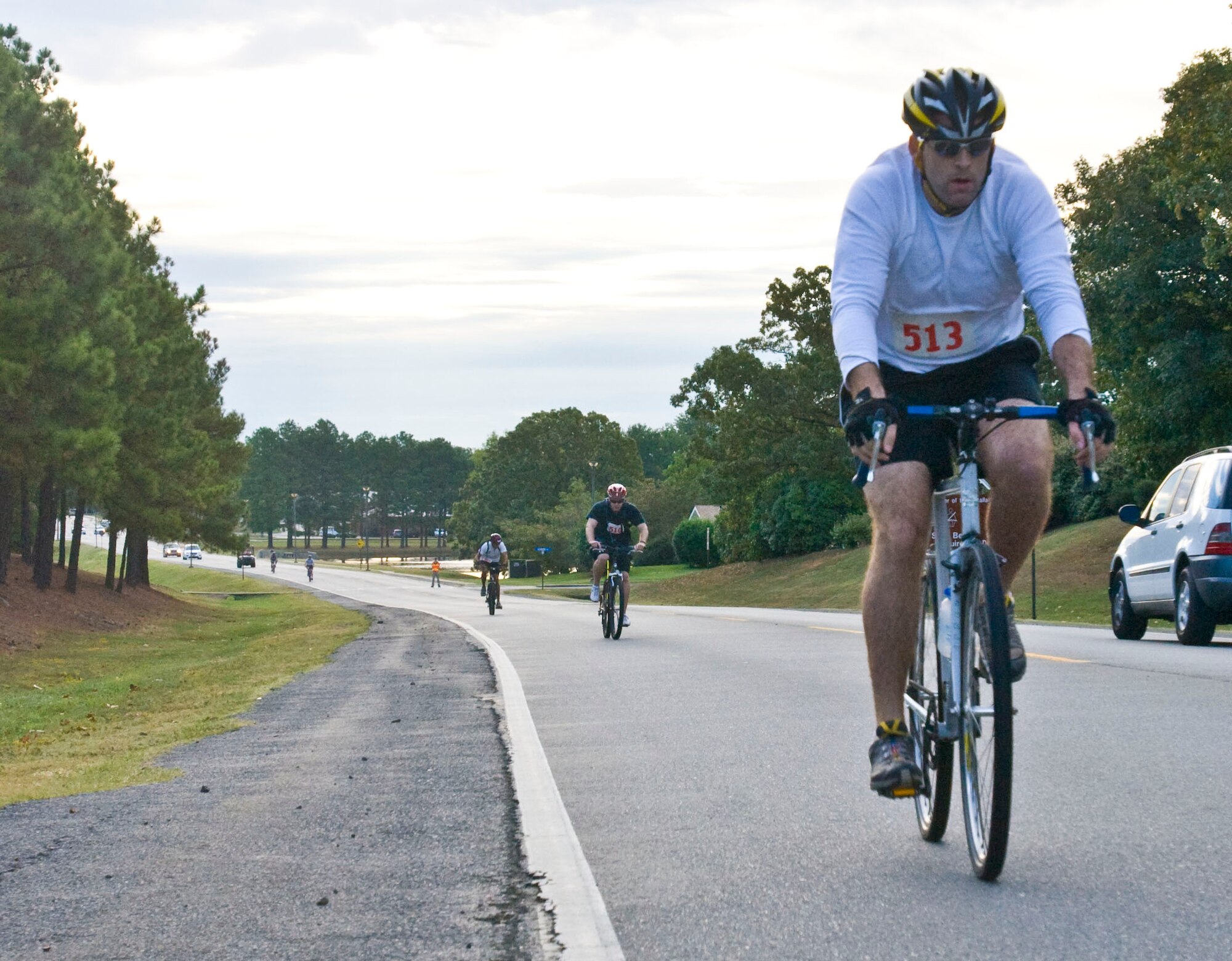1st Lt. Rick Winfield, 50th Airlift Squadron, cruises down Chief Williams Road during the biking portion of the ‘Round the Rock Adventure Race Sept. 25. More than 25 competitors participated in the race. (U.S. Air Force photo by Staff Sgt. Nestor Cruz)