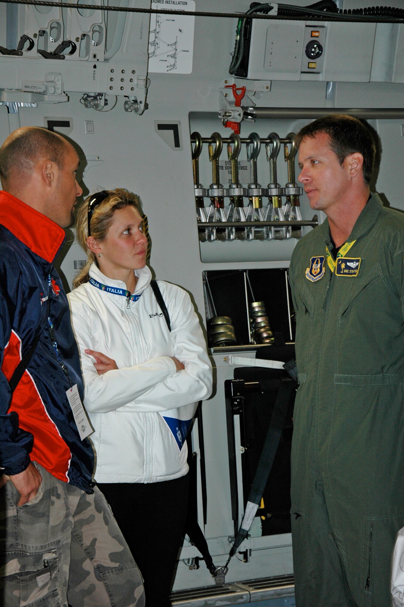 Maj. Mike Stratton, a pilot with the 317th Airlift Squadron Charleston Air Force Base, S.C., listens to a question during the Africa Aerospace and Defense airshow, Ysterplaat Air Force Base, Cape Town South Africa. Maj. Stratton and a crew of three reservists from the 315th Airlift Wing maintained a C-17 Globemaster III static display during the air and trade show Sept. 21-25. (U.S. Air Force photo/2nd Lt. Joe Simms)