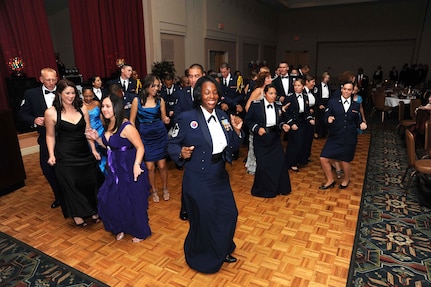 Members of the 502nd Air Base Wing dance the "Cupid Shuffle" during the 502nd ABW Air Force Birthday Ball Sept. 24 at the Gateway Club. The celebration included dancing, socializing, dinner and entertainment from the Air Force Band of the West. (U.S. Air Force photo/Alan Boedeker) 