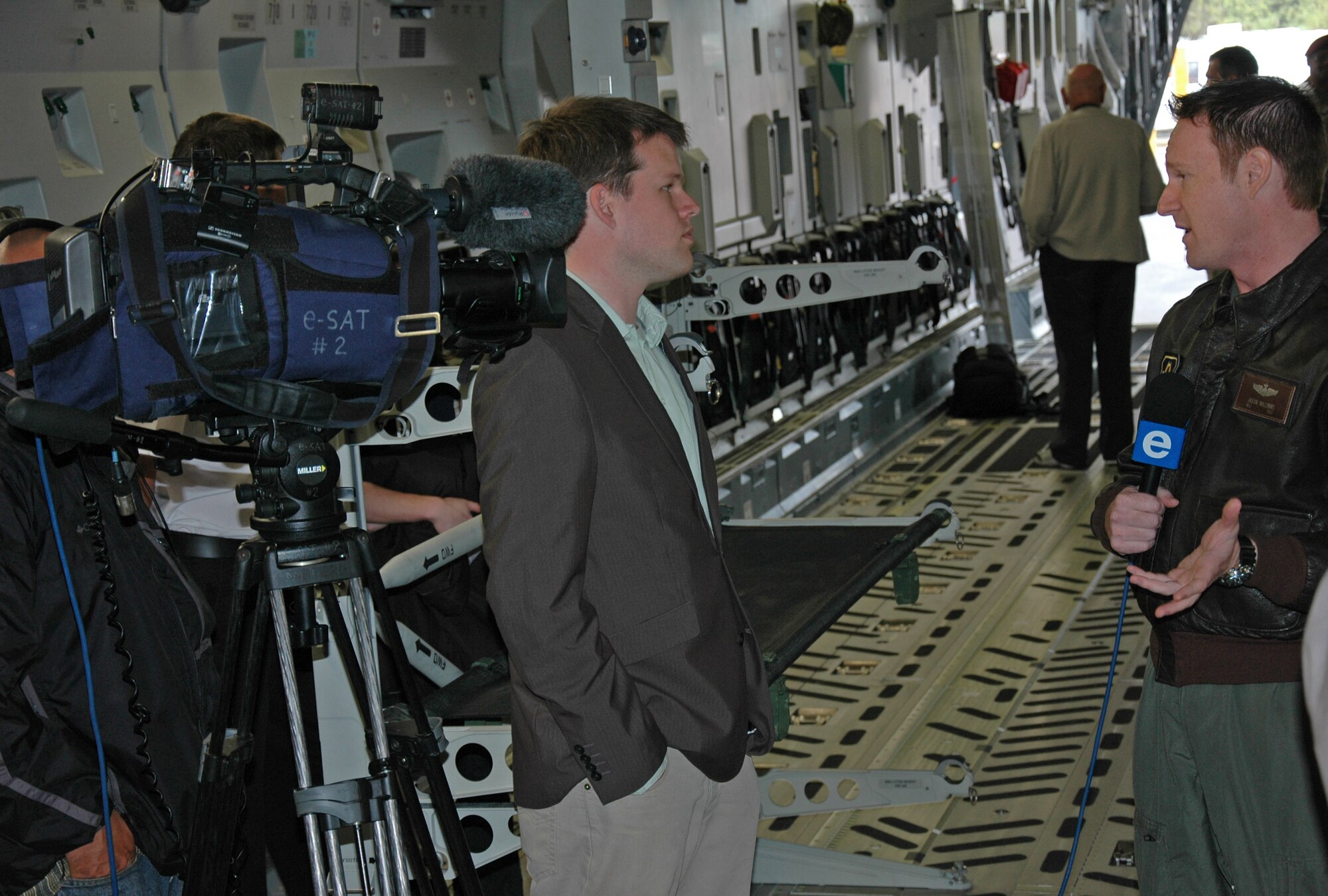 Maj. Jason Williams, a pilot with the 317th Airlift Squadron Charleston Air Force Base, S.C., is interviewed by a South African television station during the Africa Aerospace and Defense airshow, Ysterplaat Air Force Base, Cape Town, South Africa. Maj. Williams and a crew of reservists from Charleston AFB maintained a C-17 Globemaster III static display Sept. 21-25 during the international air and trade show. (U.S. Air Force photo/2nd Lt. Joe Simms)