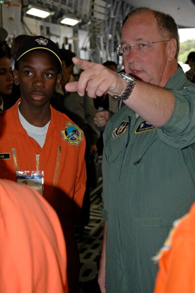 Master Sgt. George Counts, a loadmaster with the 317th Airlift Squadron, Charleston Air Force Base S.C., expains the features of the C-17 Globemaster III to a member of the Africa Aerospace and Defense Youth Development Program at Ysterplaat Air Force Base, Cape Town South Africa. The program, which focuses on getting young people the tools they need to excel in South Africa's aviation and defense industries, coincided with the five day air and trade show Sept 21-25. (U.S. Air Force photo/2nd Lt. Joe Simms)