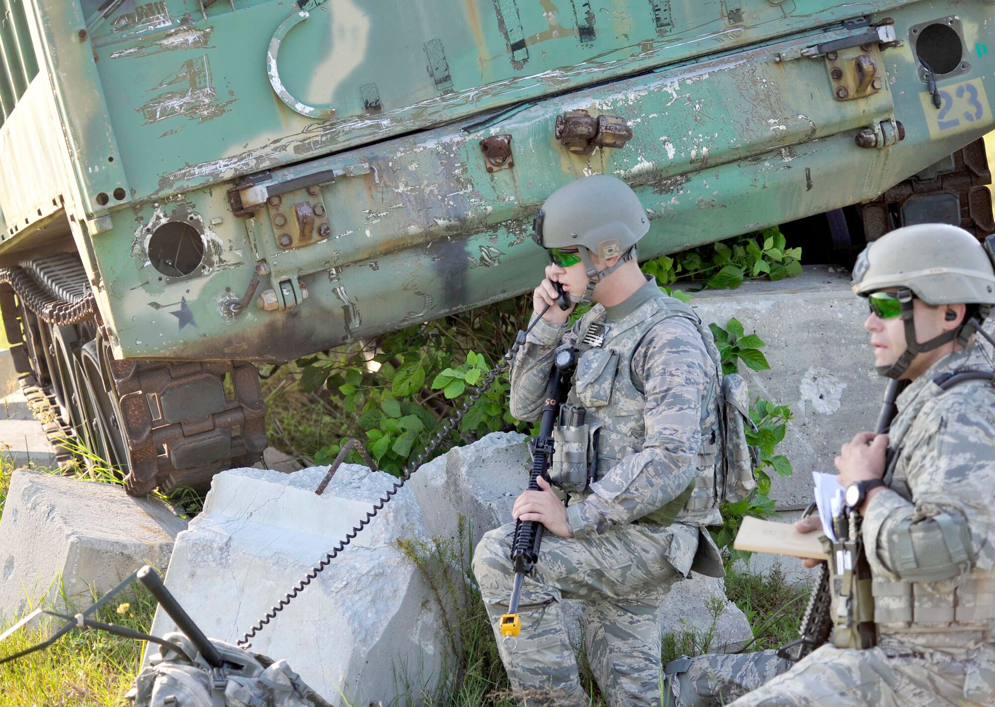 Tech. Sgt. Tony Hall (front) and Senior Airman Blake Sigmon relay their positions to their joint fires observers, Sept. 14, 2010 as part of Atlantic Strike 10-02. Atlantic Strike is a biannual Air Combat Command sponsored joint training exercise designed for the tactical employment of air power. Sergeant Hall and Airman Sigmon are Tactical Air Control Party controllers with the 118th Air Support Operations Squadron. (Air Force photo/Staff Sgt. Patrick Mitchell)