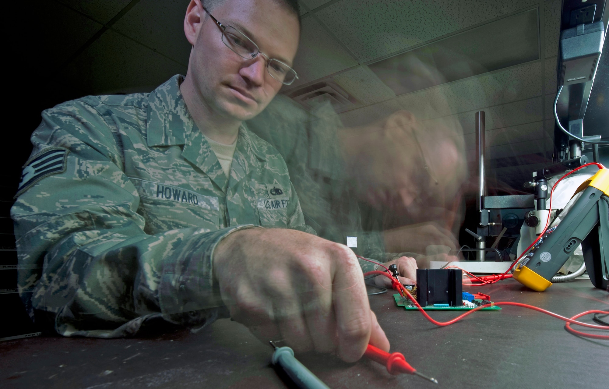 Staff Sgt. Thomas Howard uses a multimeter to test a component Sept. 21, 2010, at Holloman Air Force Base, N.M. The Air Force Repair Enhancement Program shop repairs otherwise unserviceable equipment and finds innovative ways to improve the repair process. Sergeant Thomas is a 49th Maintenance Group Air Force Repair Enhancement Program technician. (U.S. Air Force photo/ Airman 1st Class Joshua Turner)