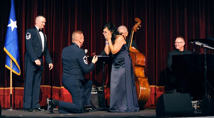 LAS VEGAS --  Senior Master Sgt. Bradley Behling, 99th Force Support Squadron sustainment services flight superintendent, proposes to his girlfriend Laura Deam during the Nellis-Creech Air Force Ball Sept 25. (U.S Air Force Photo / Senior Airman Stephanie Rubi)