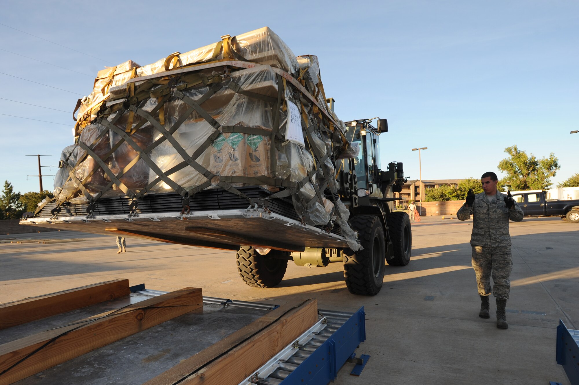 Airman Anthony Benitez, 27th Special Operations Logistics Readiness Squadron, guides the lift vehicle to the platform during an operational readiness exercise Sept. 27. The ORE is used as a training tool that ensures  that Airmen are ready to deploy and work in a deployed location.
(U.S. Air Force photo by Senior Airman Maynelinne De La Cruz)