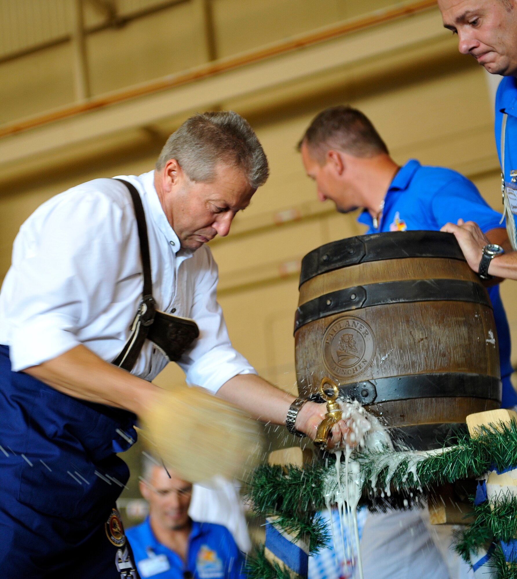 HOLLOMAN AIR FORCE BASE, N.M. -- Col Frank Kiesel, German Air Force Flying Training Center commander, taps the first keg of the evening during the 14th Annual Oktoberfest celebration Sept. 25, 2010. After a welcoming speech and a toast given to all those attending, guests enjoyed the evening of Holloman's version of the biggest fair in the world with music, food and drinks. (U.S. Air Force photo by Senior Airman Veronica Stamps / Released)

