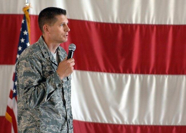 NELLIS AIR FORCE BASE, Nev.-- Brig. Gen. David Thompson, U.S Air Force Warfare Center vice commander, speaks during the Nellis, Creech and Nevada Test and Training Range Retiree Appreciation Day Sept. 25. The event included health screenings, K-9 and explosive ordnance disposal demonstrations, entertainment, door prizes and a free lunch for more than 800 attendees at the Thunderbird hangar. (U.S. Air Force photo by Staff Sgt. Richard Rose)