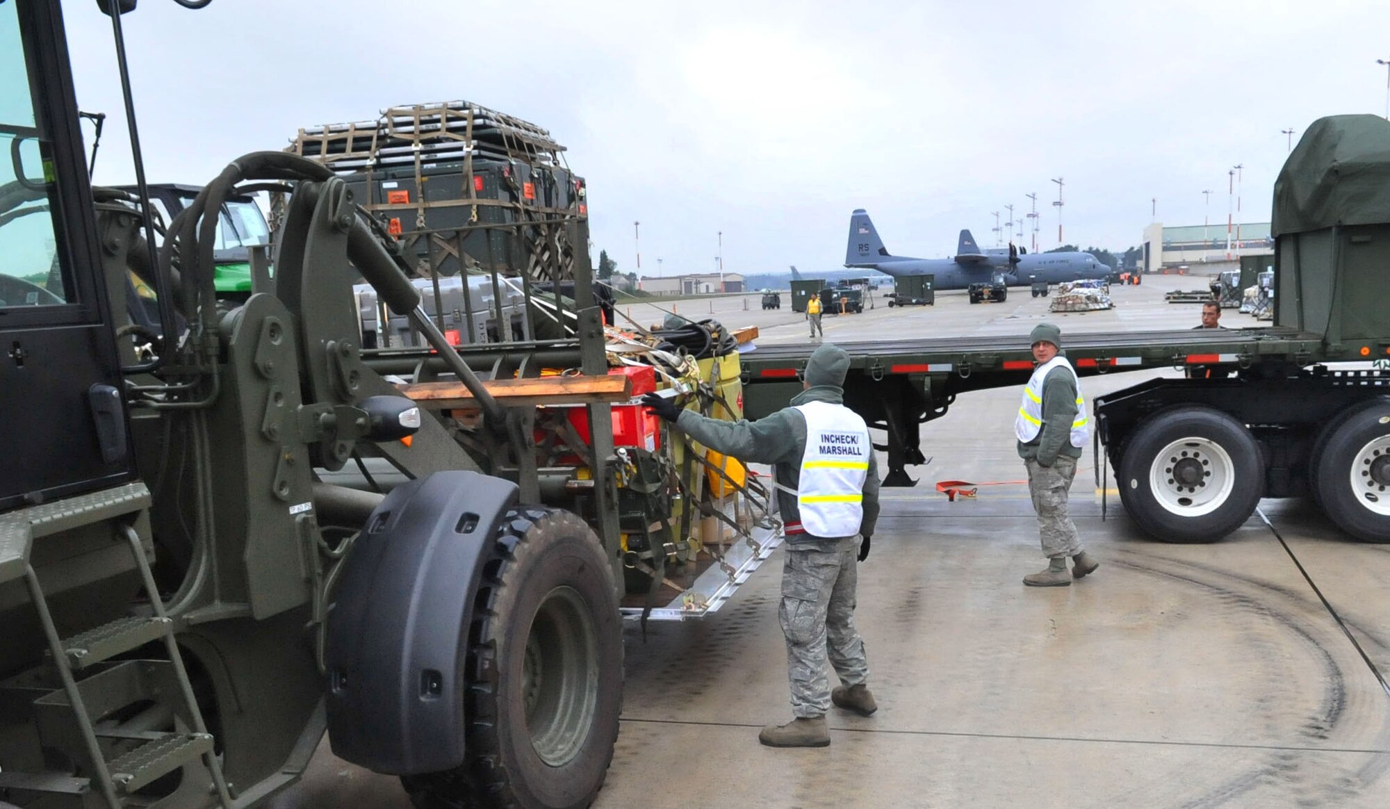 U.S. Air Force personnel unload equipment during an Operational Readiness Inspection , Ramstein Air Base, Germany, Sept. 28, 2010. The ORI is designed to test Airmen's ability to survive, operate and perform fundamental duties in a war time environment. (U.S. Air Force photo by Airman 1st Class Desiree Esposito)
