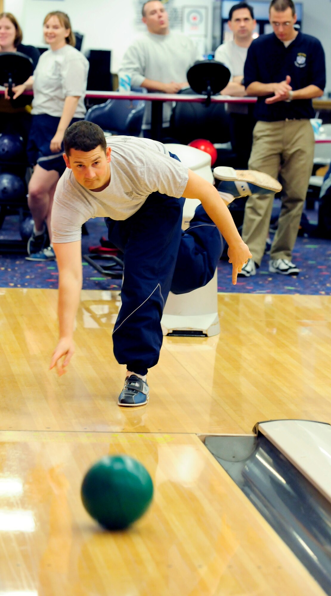 RAF MILDENHALL, England -- Second Lt. Adam Latapie, 100th Mission Support Group, bowls during the bowling tournament held on Wing Sports Day here Sept. 24. Other events that were held on sports day included volleyball, tug-of-war, ultimate football and one-pitch softball. (U.S. Air Force photo/Senior Airman Ethan Morgan)