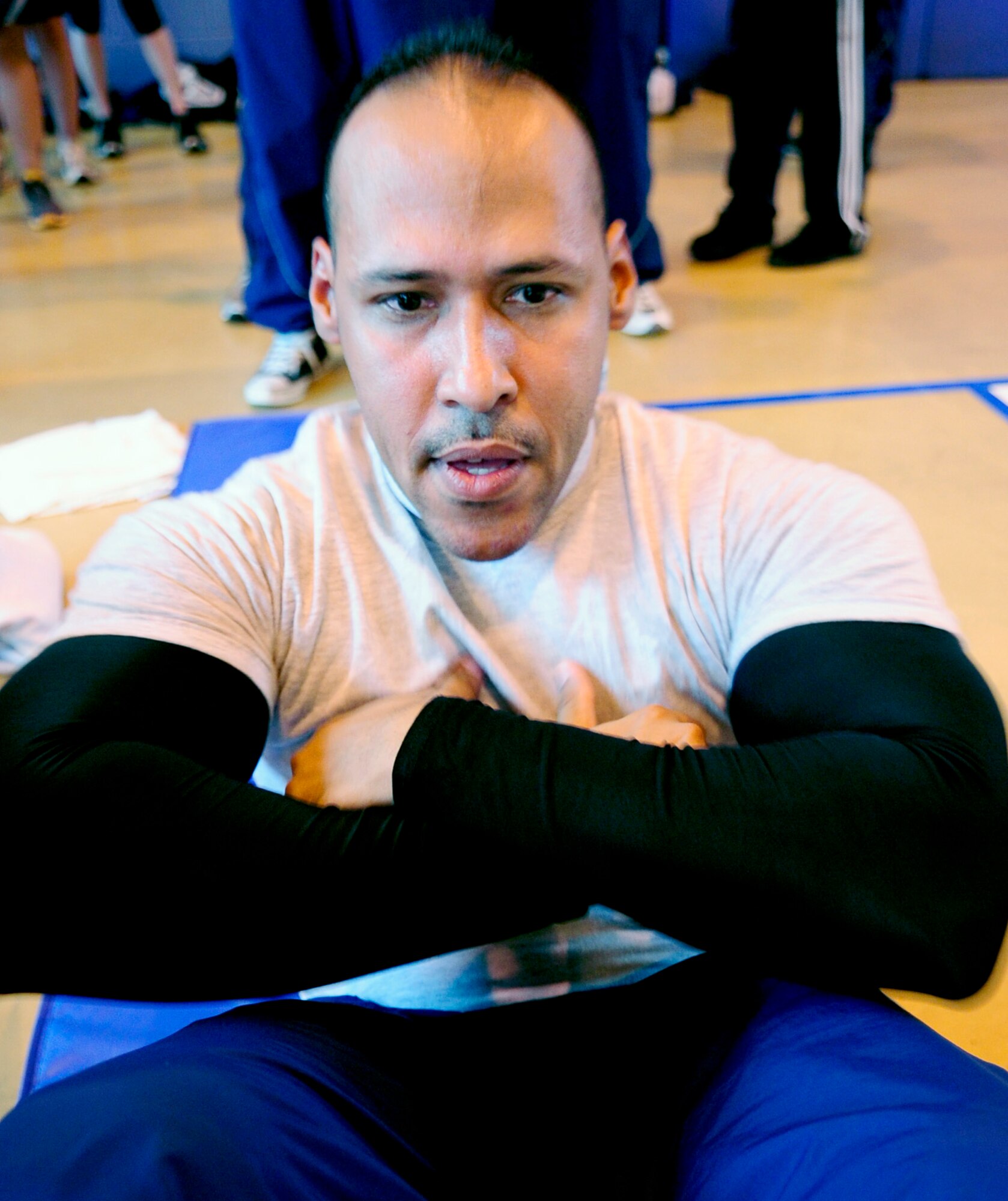 RAF MILDENHALL, England -- Staff Sgt. Michael Perez, 100th Security Forces Squadron, does sit-ups in the one Hour Sit-up Contest during Wing Sports Day here Sept. 24. The total amount of sit-ups that all the Airmen who participated in the contest was 16,018. (U.S. Air Force photo/Senior Airman Ethan Morgan)