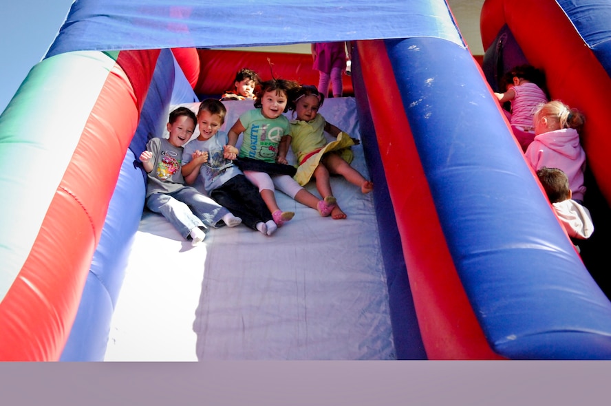 MINOT AIR FORCE BASE, N.D. -- Air Force Global Strike Command Airmen and their families at Minot AFB celebrated the beginning of autumn during the 12th Annual Fall Festival in the Base Exchange parking lot here Sept. 25. Pumpkin-bowling, face and hair painting, creating balloon animals and scarecrow-making were among some of the activities enjoyed by all. (U.S. Air Force photo by Capt. Genieve David)