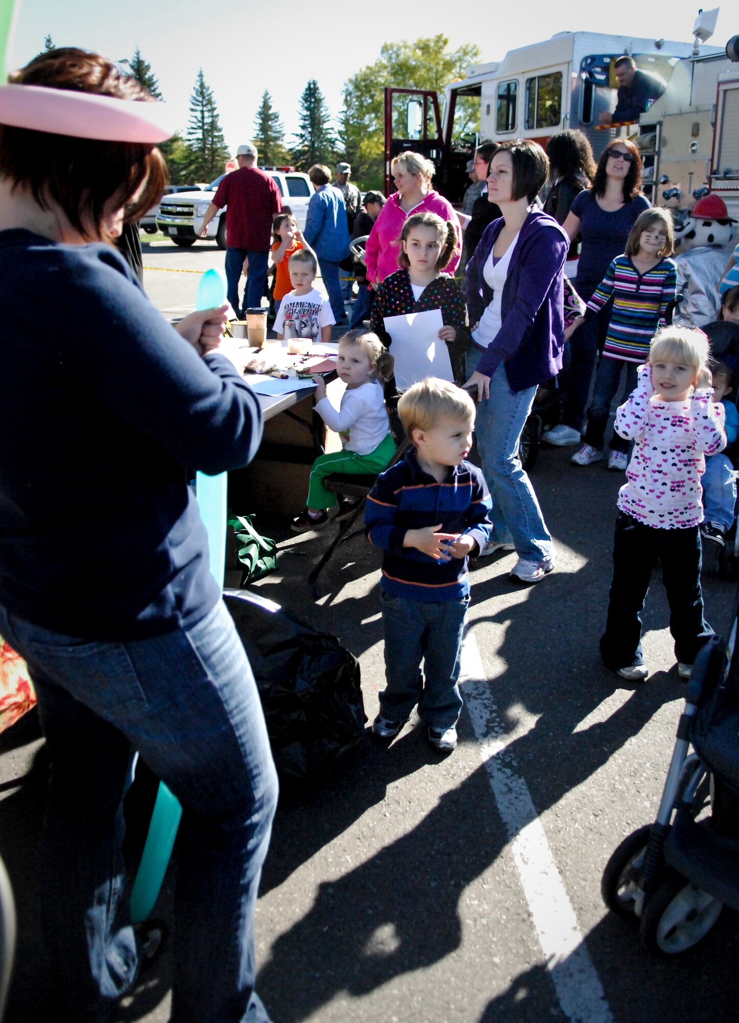 MINOT AIR FORCE BASE, N.D. -- Air Force Global Strike Command Airmen and their families at Minot AFB celebrated the beginning of autumn during the 12th Annual Fall Festival in the Base Exchange parking lot here Sept. 25. Pumpkin-bowling, face and hair painting, creating balloon animals and scarecrow-making were among some of the activities enjoyed by all. (U.S. Air Force photo by Capt. Genieve David)