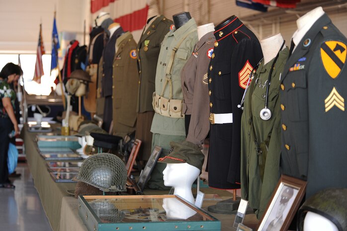 NELLIS AIR FORCE BASE, Nev.-- Military uniforms dating as far back as World War I were displayed during the Nellis, Creech and Nevada Test and Training Range Retiree Appreciation Day Sept. The event included health screenings, K-9 and explosive ordnance disposal demonstrations, entertainment, door prizes and a free lunch for more than 800 attendees at the Thunderbird hangar. (U.S Air Force Photo / Senior Airman Stephanie Rubi)