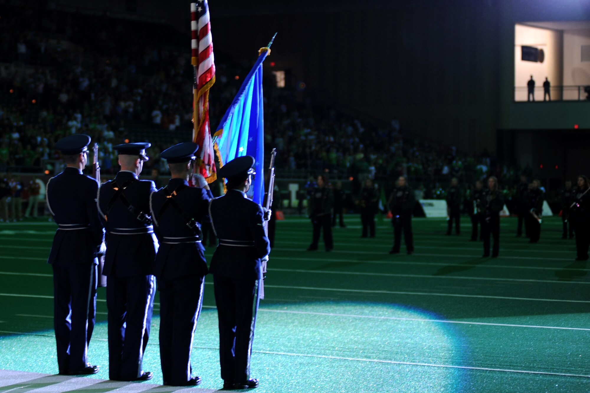 Airmen from the Grand Forks Air Force Base Honor Guard present the colors during the University of North Dakota military appreciation football game Sept. 25 at the Alerus Center in Grand Forks, N.D. The Grand Forks Chamber of Commerce Military Affairs Committee supplied food and tickets to military members and their families. The UND Fighting Sioux defeated the Northwestern State University Demons 49-24. (U.S. Air Force photo by Senior Airman Amanda N. Stencil)