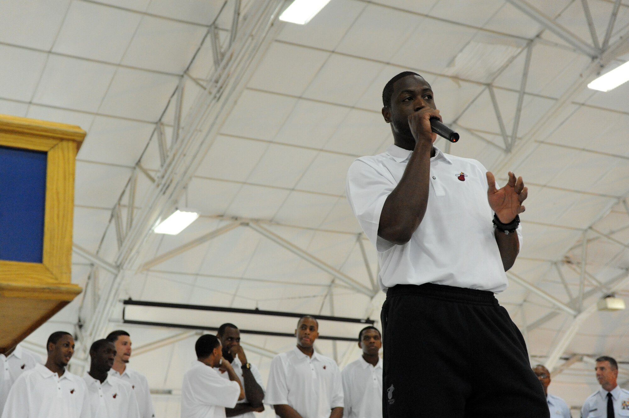 Dwayne Wade, a guard for the Miami HEAT, speaks to the crowd during the HEAT's arrival at Eglin Air Force Base, Fla., for their 2010 Training Camp at Hurlburt Field, Fla., Sep. 27, 2010. This is the first time in 23 years the HEAT has taken their training camp on the road.  Hurlburt Field will host the team's contingent of 44 from Sep. 28, through Oct. 3, 2010.  (DoD photo by Airman 1st Class Caitlin O'Neil-McKeown)
