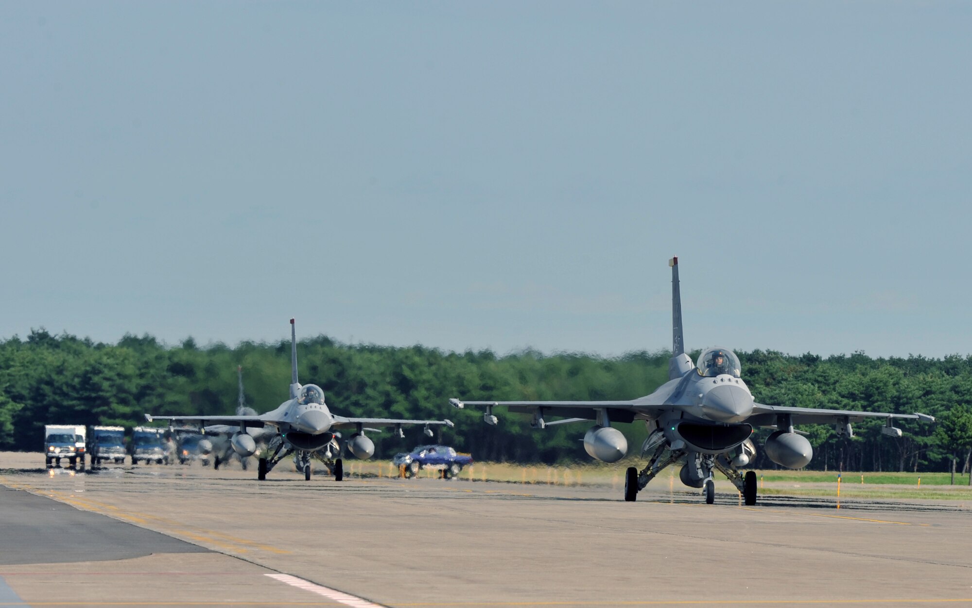 U.S. Air Force F-16 Fighting Falcons from the 13th Fighter Squadron taxi on the runway as they prepare to leave  in support of Operation New Dawn, Sept. 27. 2010, at Misawa Air Base, Japan. The F-16 has a wingspan of more than 32 feet and can reach speeds of more than 1,500 miles per hour.(U.S. Air Force photo by Tech. Sgt. Russell McBride/Released)