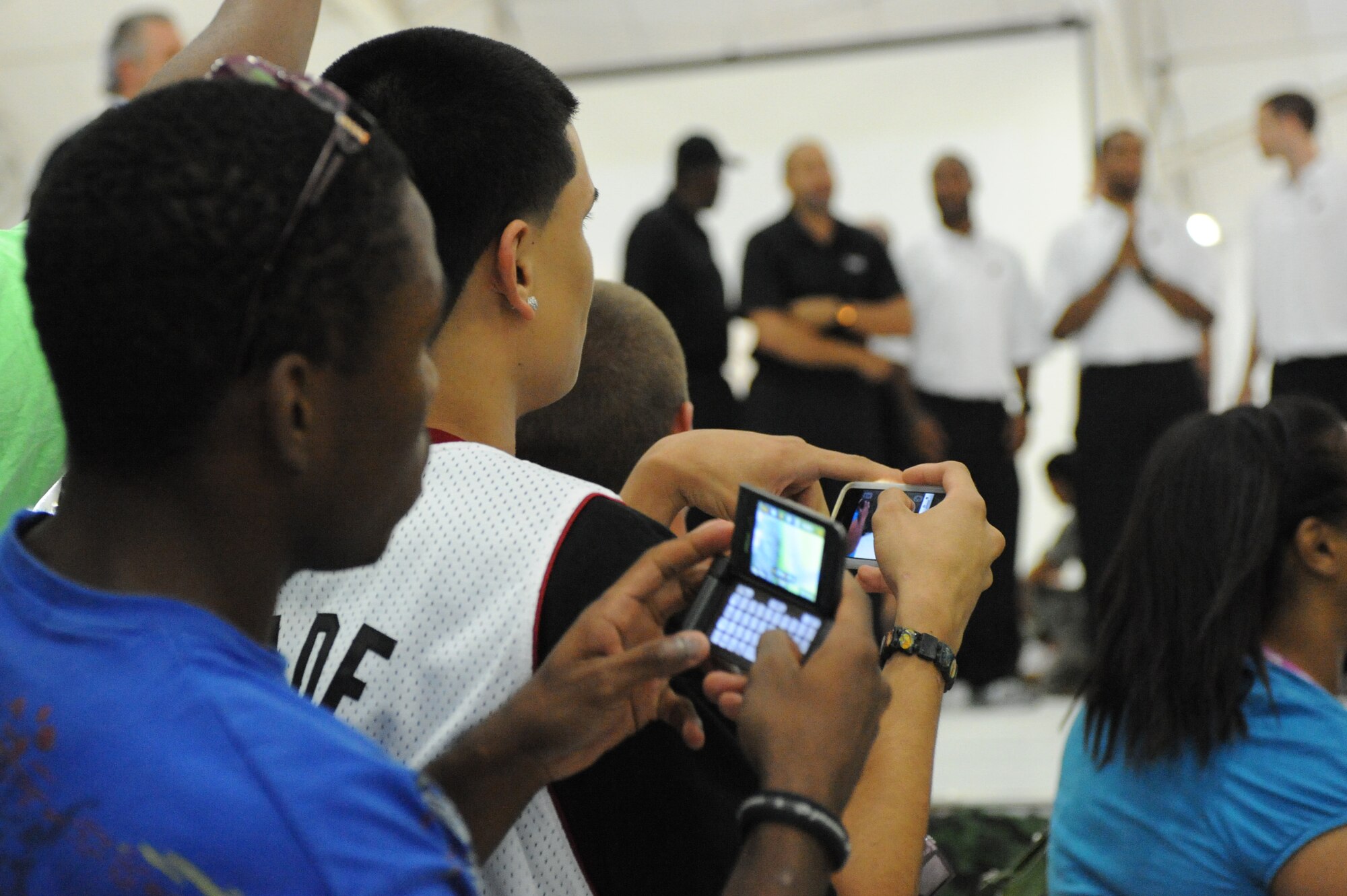 Fans attempt to take video and pictures of the Miami HEAT during the HEAT's reception at Eglin Air Force Base, Fla., for their 2010 Training Camp at Hurlburt Field, Fla., Sep. 27, 2010. This is the first time in 23 years the HEAT has taken their training camp on the road.  Hurlburt Field will host the team's contingent of 44 from Sep. 28, through Oct. 3, 2010.  (DoD photo by Airman 1st Class Caitlin O'Neil-McKeown)
