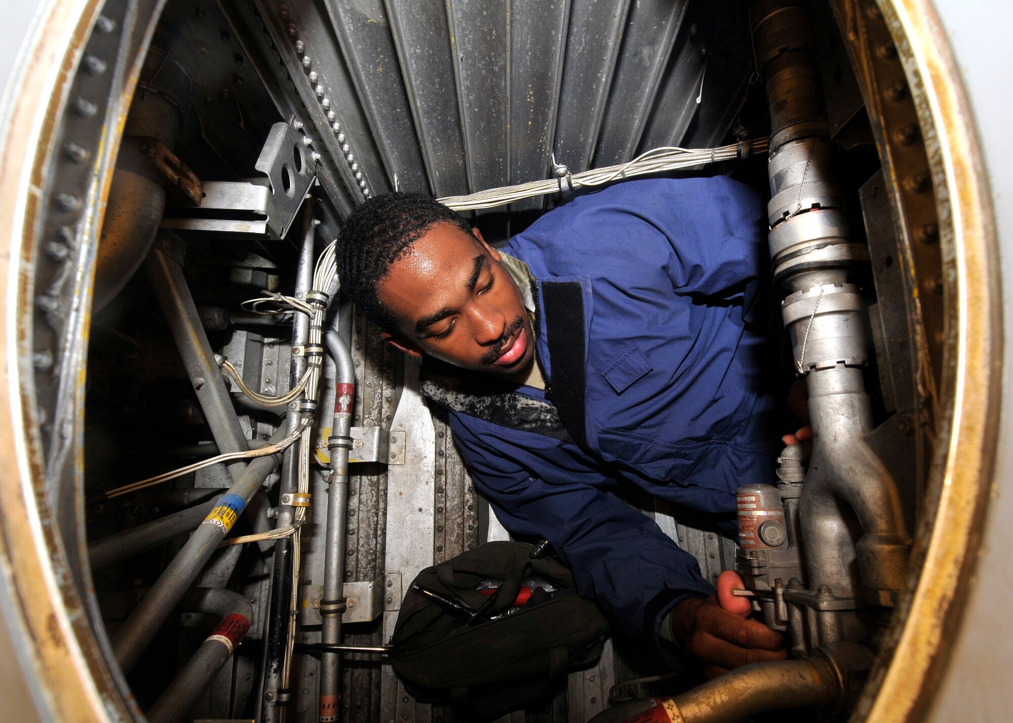 Senior Airmen Terrance Walton, 332nd Expeditionary Maintenance Squadron aircraft fuel systems technician, checks the serviceability of a fuel control valve on a C-130 Hercules after a phase inspection Sept. 22, 2010, Joint Base Balad. The 332 EMXS Fuels Shop performs maintenance on F-16 Fighting Falcons and C-130 Hercules aircraft. Airman Walton is a native of Cuthbert, Ga., deployed from Little Rock Air Force Base, Ark. (Air Force photo/Staff Sgt. Phillip Butterfield)