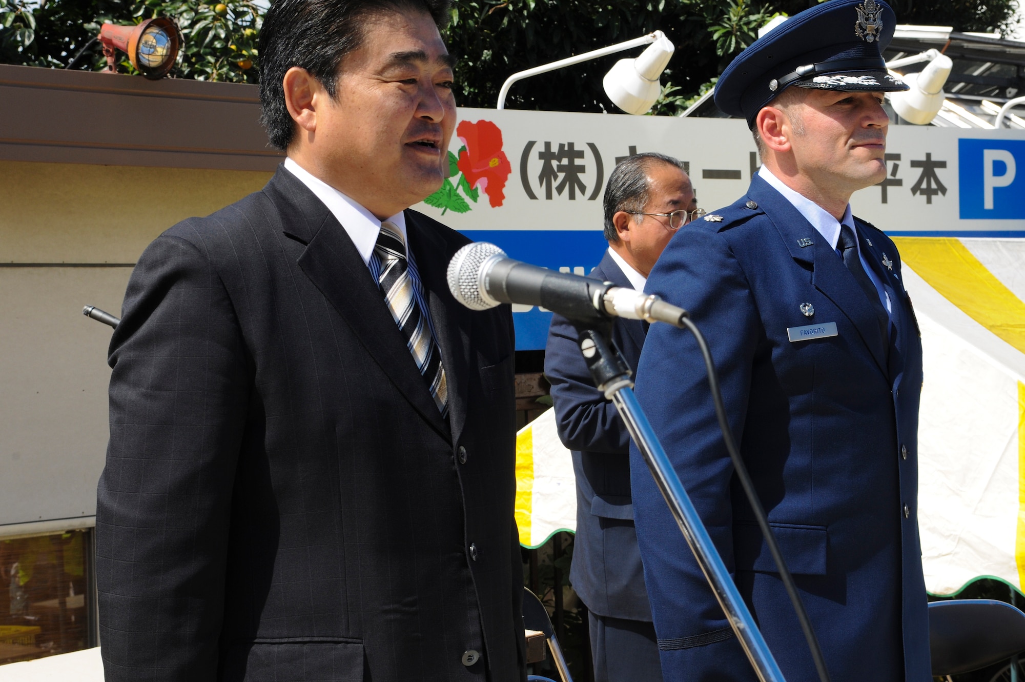 YOKOTA AIR BASE, Japan -- Ikuo Kato, the mayor of Fussa City, and Lt. Col. Rocky Favorito, 374th Communications Squadron commander, perform the official review of the 2010 Fussa International Festival Parade. The parade was held right outside Yokota Air Base, September 26. (U.S. Air Force photo by Staff Sgt Stacy Moless)