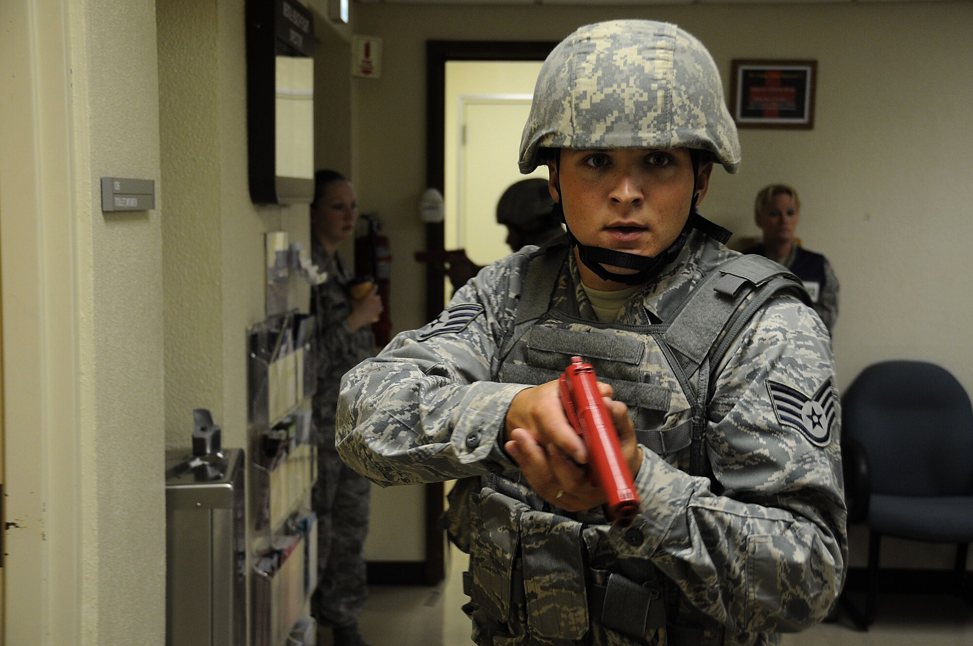 Staff Sgt. Kyle Billings, a member of the 18th Security Forces Squadron, secures a hallway during a Kadena Air Base, Japan exercise Sept. 28. This exercise tested the 18th Wing's ability to respond to a simulated "shots fired" scenario. (U.S. Air Force photo/Staff Sgt. Darnell T. Cannady)