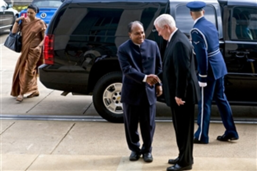 U.S. Defense Secretary Robert M. Gates greets Indian Defense Minister Arackaparambil Kurian Antony before a meeting at the Pentagon, Sept. 28, 2010.  