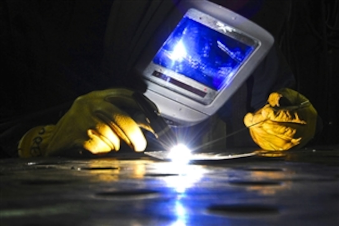 U.S. Navy Seaman Ruben Torres practices tungsten inert gas welding aboard the aircraft carrier USS Harry S. Truman in the Arabian Sea, Sept. 25, 2010. The Harry S. Truman Carrier Strike Group is deployed supporting maritime security operations and theater security cooperation efforts in the U.S. 5th Fleet area of responsibility. Torres is a hull maintenance technician and fireman.