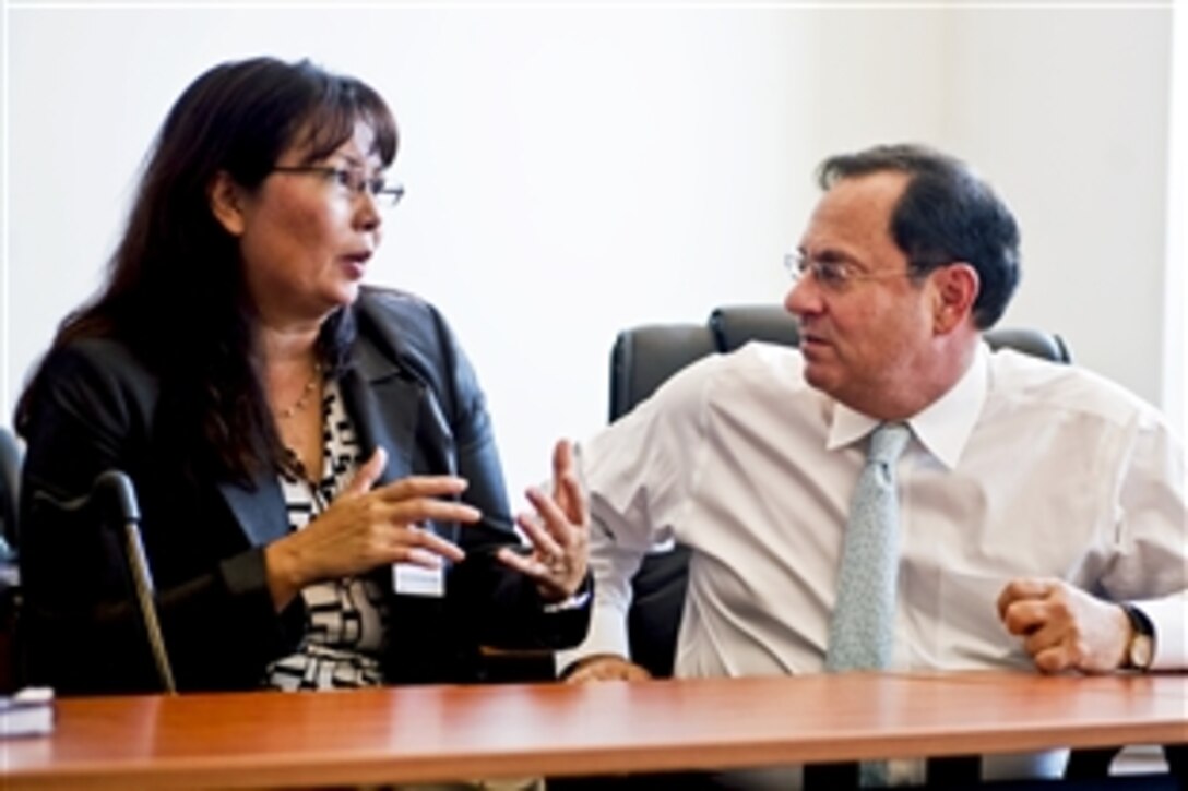 Assistant Secretary of  Defense for Public Affairs Doug Wilson meets with Veterans Affairs Assistant Secretary Tammy Duckworth to discuss mutual areas of support for veterans and their families at the Pentagon, Sept. 28, 2010.