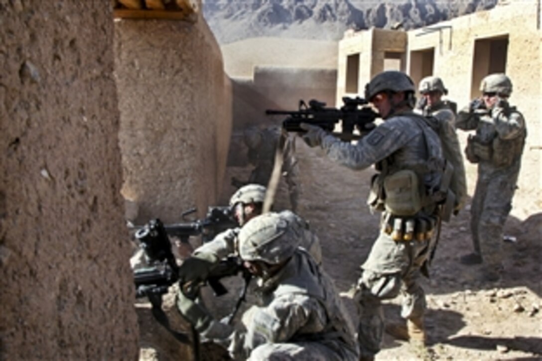 U.S. Army soldiers return fire while engaging enemy combatants in the Chak district, Wardak province, Afghanistan, Sept. 25, 2010. The soldiers are assigned to Company A, 1st Battalion, 503rd Infantry Regiment, 173rd Airborne Brigade Combat Team.