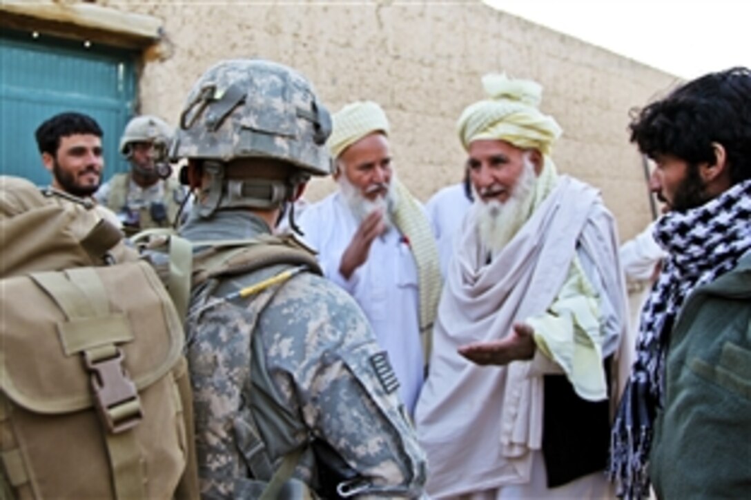 U.S. Army 2nd Lt. Stephen Petraeus, center, speaks to Afghan men after searching their homes for weapons in the Chak district, Wardak province, Afghanistan, Sept. 24, 2010. Petraeus is assigned to Company A, 1st Battalion, 503rd Infantry Regiment, 173rd Airborne Brigade Combat Team.
