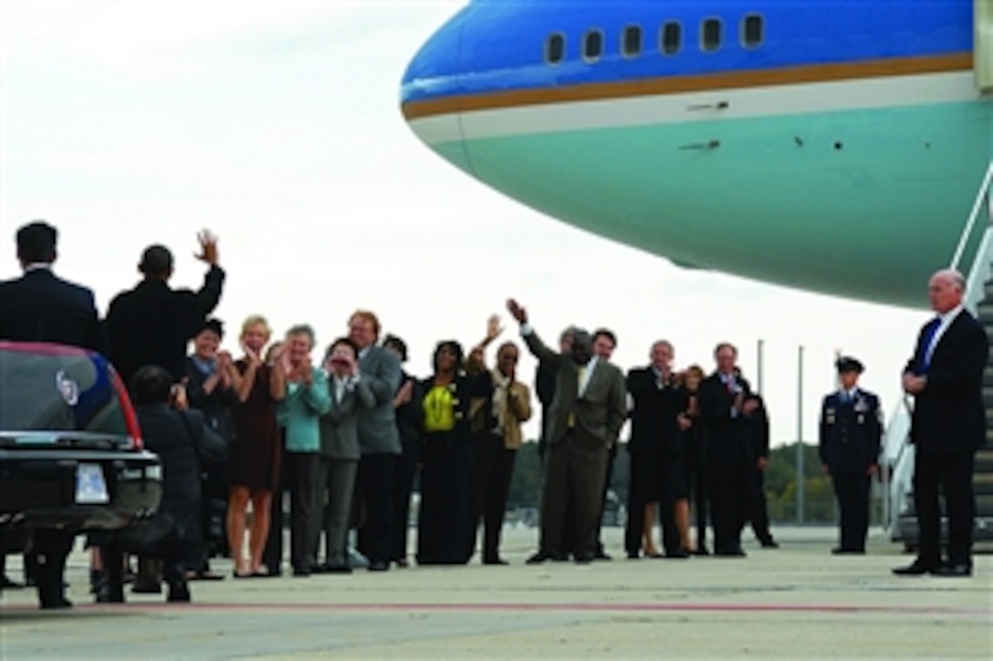 President Barack Obama waves to well-wishers upon his arrival at the Wisconsin Air National Guard's 115th Fighter Wing base on Truax Field in Madison, Wis., Sept. 28, 2010. Obama was en route to an appearance at the University of Wisconsin.