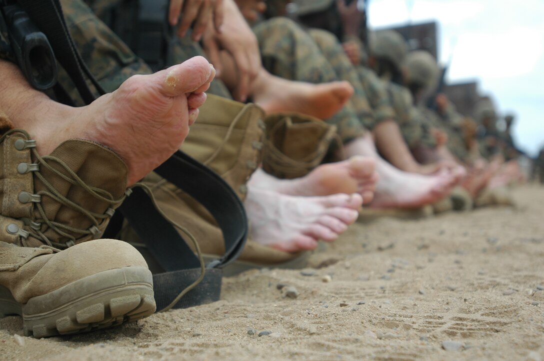 Company B recruits put their feet out on display as they await a Navy corpsman to check their health prior to engaging in the 12-stall exercise of the Crucible at Edson Range, Marine Corps Base Camp Pendleton, Calif., Sept. 28. The Crucible is a 54-hour-long training event in which recruits undergo food and sleep deprivation to create a simulated combat stress and are almost always on their feet.