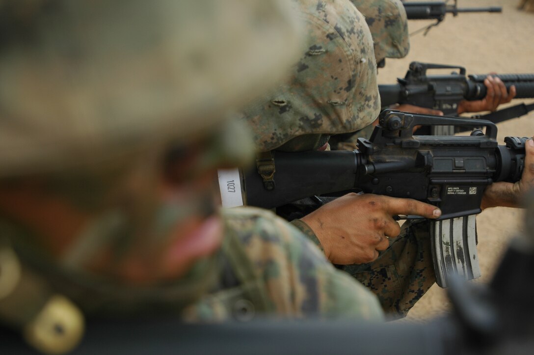 Platoon 1027 recruits, Company B, provide security for their squad mates during one of the 11 obstacles of the 12-stall event of the Crucible at Edson Range, Marine Corps Base Camp Pendleton, Calif., Sept. 28. Recruits learn that every member of a squad is needed in one way or another; whether it is leading, following directions to complete the objective or protecting the rest of the squad by providing security, the mission will most likely fail unless every Marine does his part.