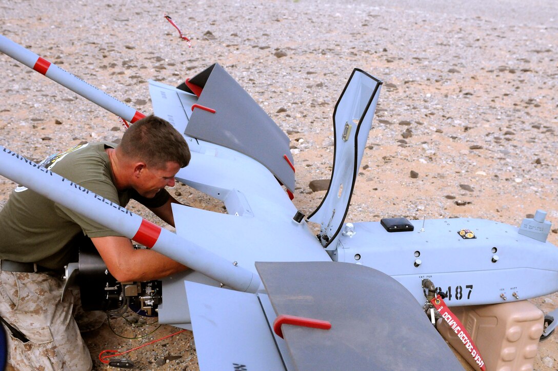 Sgt. Justin Wardlow, 27 from Carbondale, Pa., Marine Unmanned Aerial Vehicle Squadron 4 unmanned aircraft mechanic, performs preflight maintenance on an RQ-7B Shadow unmanned aircraft before the squadron’s inaugural flight at Auxiliary Airfield 2 in Yuma, Ariz., Sept. 28, 2010. During the flight, the squadron showcased the aircraft’s reconnaissance and surveillance capabilities with a live video feed from the Shadow’s onboard camera. The Yuma detachment of the Texas-based reserve squadron is the only operational component of the unit and is composed of mostly active duty Marines. The detachment, which began assembling at the Marine Corps Air Station in Yuma, Ariz., in June, has four Shadows and consists of approximately 40 Marines.