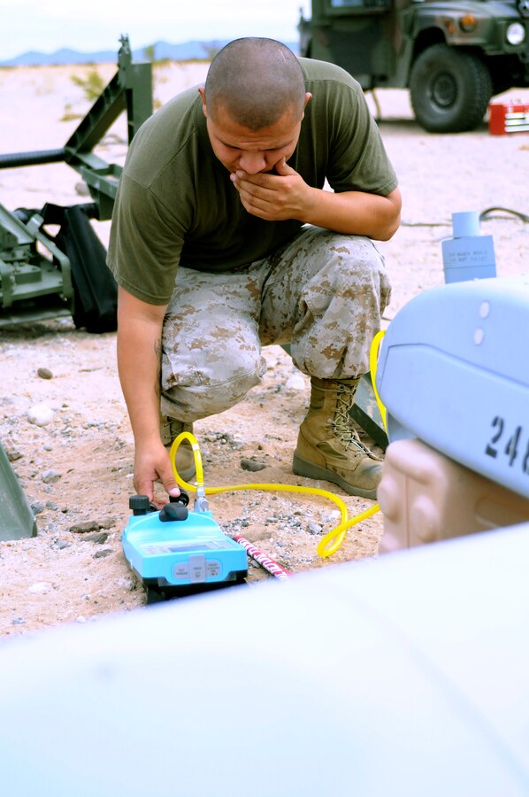 Sgt. Juan Fernandez, 25 from Grand Island, Neb., Marine Unmanned Aerial Vehicle Squadron 4 unmanned aircraft mechanic, runs preflight systems tests on an RQ-7B Shadow unmanned aircraft before the squadron’s inaugural flight at Auxiliary Airfield 2 in Yuma, Ariz., Sept. 28, 2010. During the flight, the squadron showcased the aircraft’s reconnaissance and surveillance capabilities with a live video feed from the Shadow’s onboard camera. The Yuma detachment of the Texas-based reserve squadron is the only operational component of the unit and is composed of mostly active duty Marines. The detachment, which began assembling at the Marine Corps in Yuma, Ariz., in June, has four Shadows and consists of approximately 40 Marines.